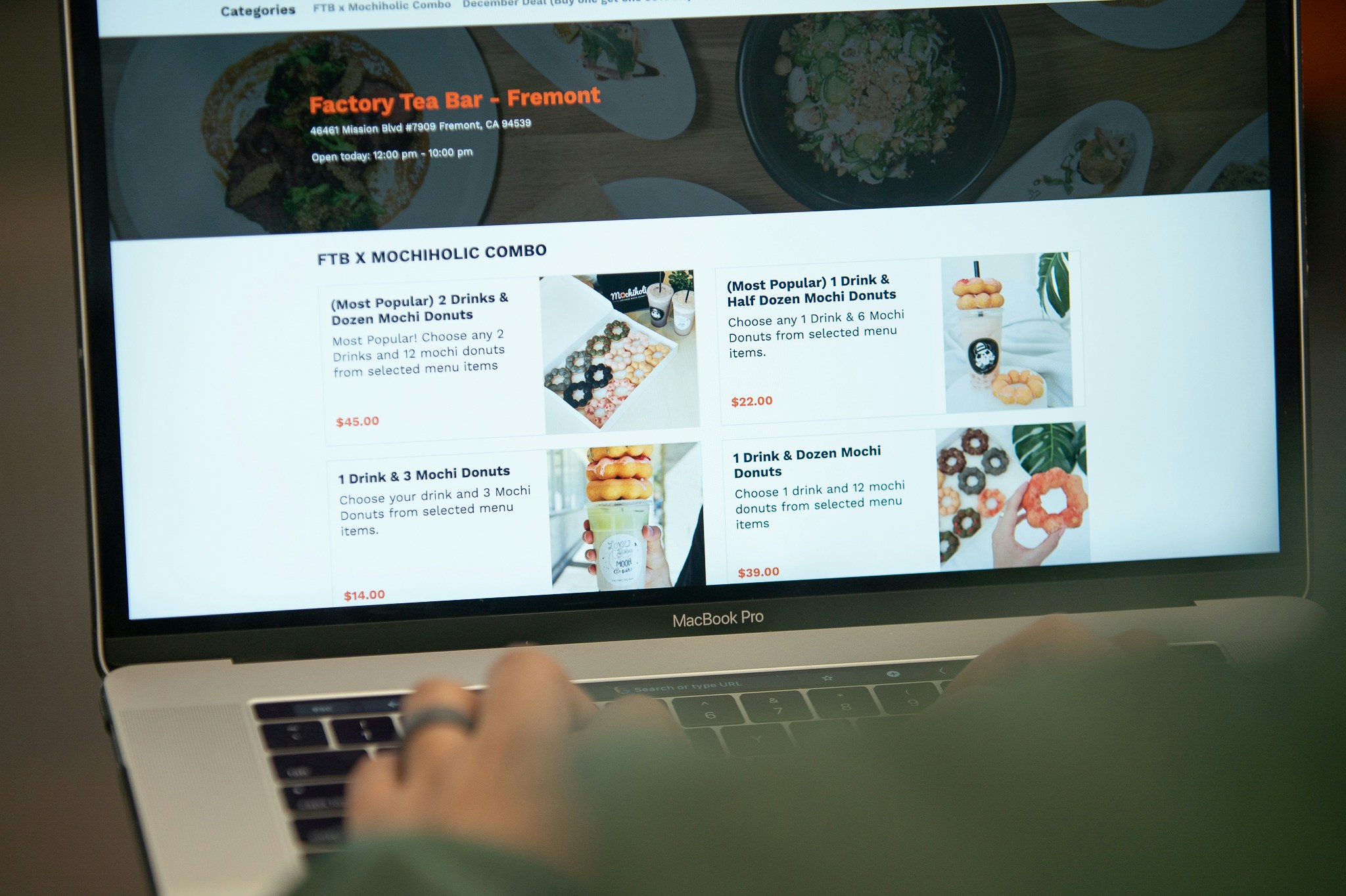 Online food ordering screen displayed on a laptop.
